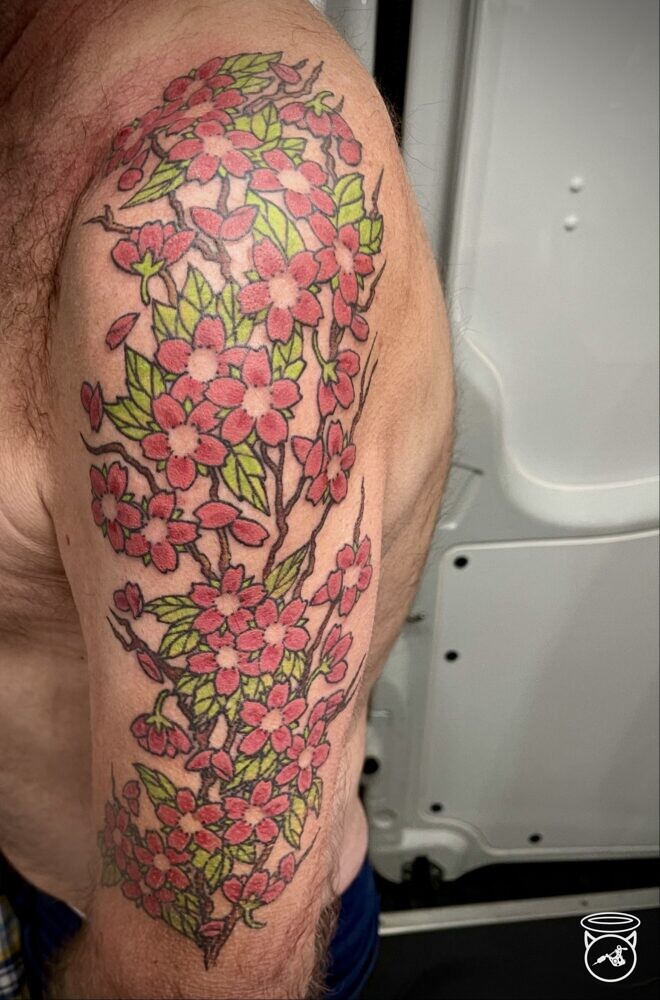 Traditional Cherry Blossom Tattoo done at On the Road Tattoo